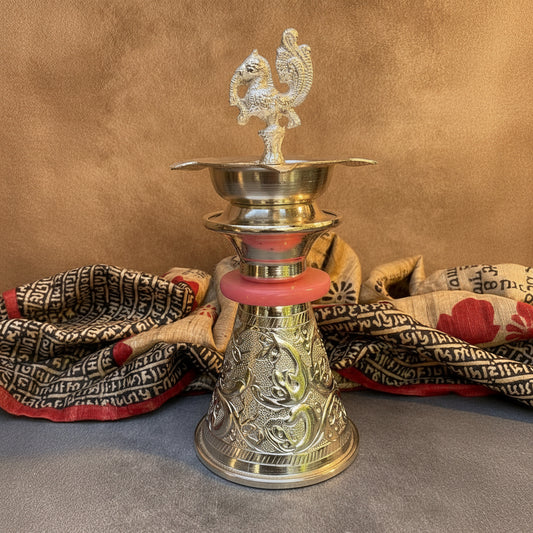 Ambi Divine Silver Plated Peacock Oil Lamp – Decorative Pooja Diya with Ornate Base