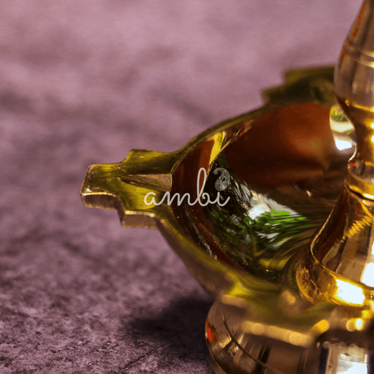Close-up of a decorative item with 'ambi' branding on a textured purple background